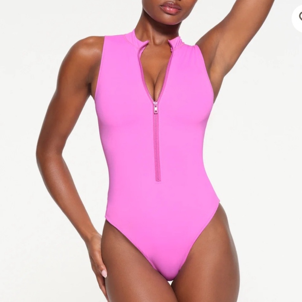 Skims recycled swim zip front sleeveless one piece neon orchid